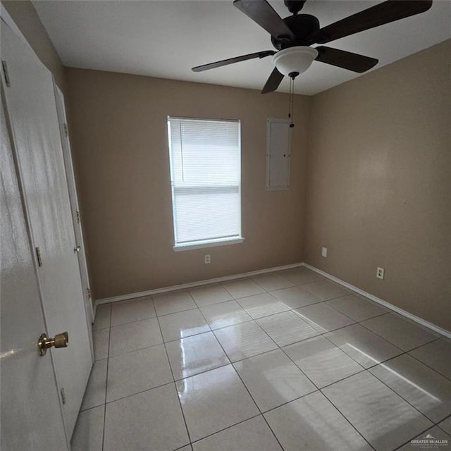 9218 N 29th Ln, Mcallen, TX 78504 - unfurnished bedroom with baseboards, ceiling fan, and light tile patterned floors