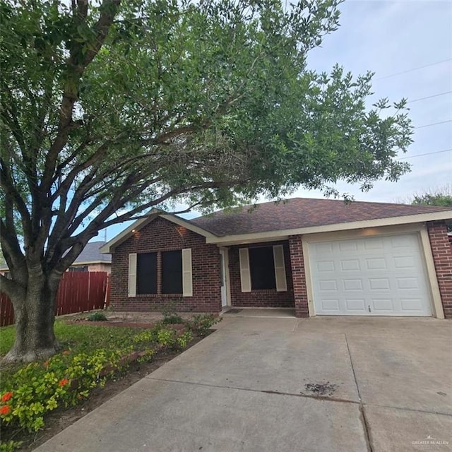 9218 N 29th Ln, Mcallen, TX 78504 - ranch-style house featuring a garage, fence, concrete driveway, and brick siding