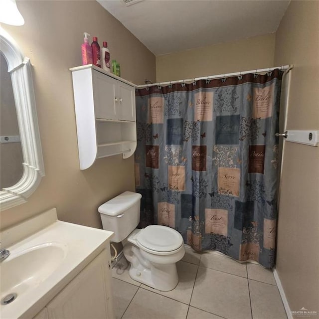 9218 N 29th Ln, Mcallen, TX 78504 - full bathroom featuring a shower with curtain, tile patterned floors, vanity, and toilet