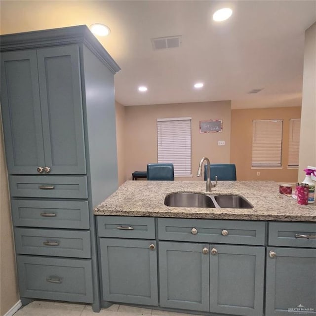 9218 N 29th Ln, Mcallen, TX 78504 - kitchen featuring gray cabinets, visible vents, a sink, light stone counters, and recessed lighting