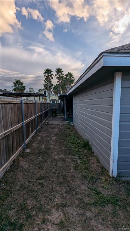 view of yard at dusk