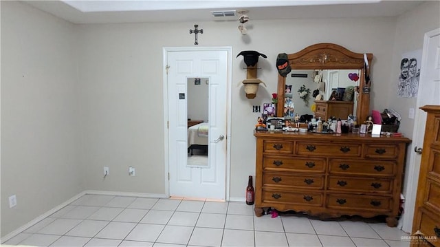 bedroom featuring light tile patterned floors