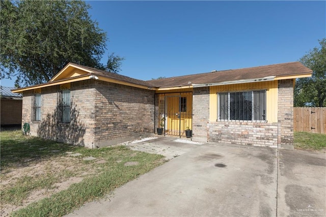 5901 N 23rd Ln, Mcallen, TX 78504 - view of front of home featuring brick siding and a patio