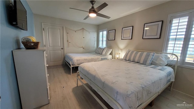 bedroom featuring ceiling fan and light wood-type flooring