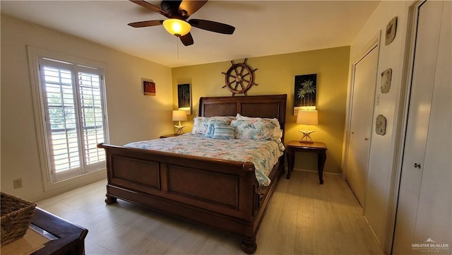 bedroom featuring light wood-type flooring and ceiling fan