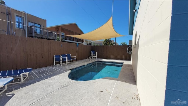 view of pool featuring a patio area