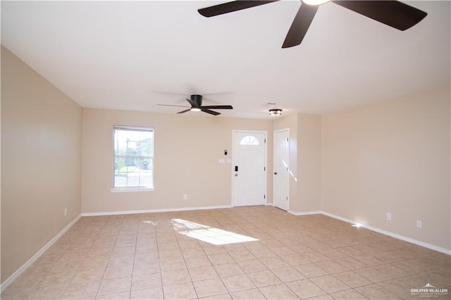 unfurnished room featuring ceiling fan and light tile patterned flooring