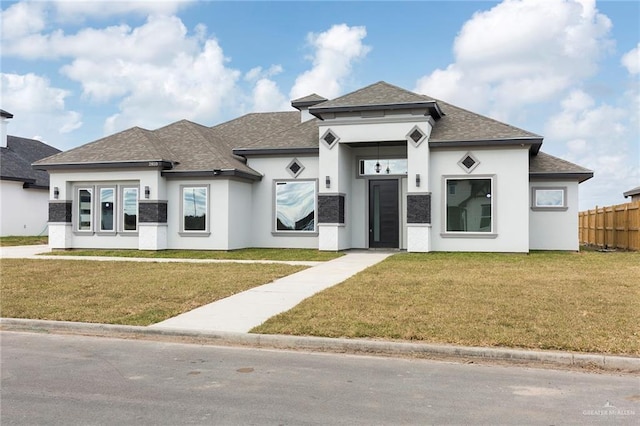 prairie-style home with a front yard