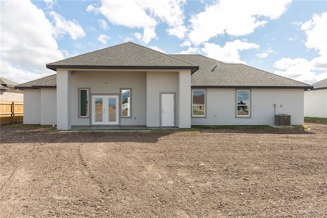 back of property featuring french doors and central air condition unit