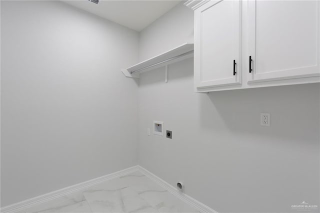 clothes washing area with cabinets, hookup for a washing machine, and electric dryer hookup