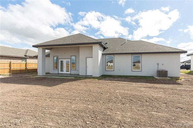 rear view of property featuring french doors, a patio, and central air condition unit