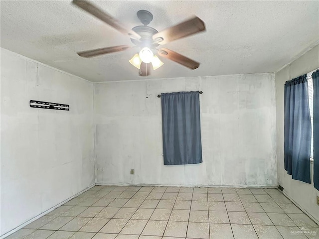 420 Vfw Ave, Elsa, TX 78543 - empty room with a textured ceiling and a ceiling fan