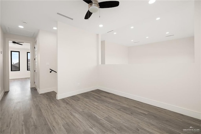 spare room with ceiling fan and hardwood / wood-style flooring