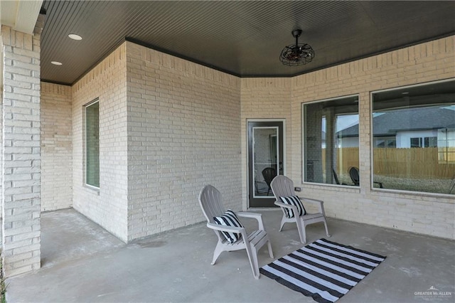 view of patio featuring ceiling fan