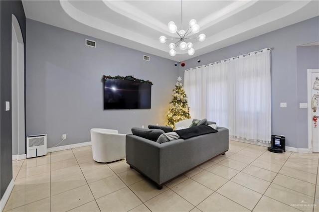 2100 W 42 1/2 St, Mission, TX 78573 - living area with an inviting chandelier, a raised ceiling, light tile patterned flooring, and visible vents