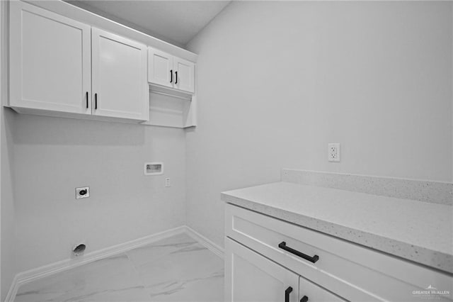 laundry room featuring washer hookup, marble finish floor, cabinet space, electric dryer hookup, and baseboards