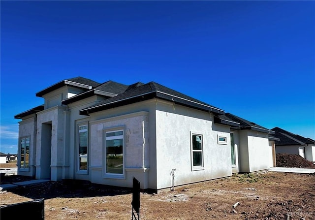 view of property exterior with stucco siding