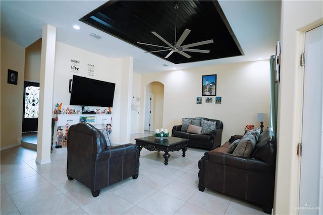 living room with ceiling fan and light tile patterned flooring