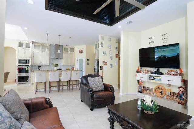 20985 Espinoza Rd, San Benito, TX 78586 - living room with light tile patterned floors, recessed lighting, and arched walkways