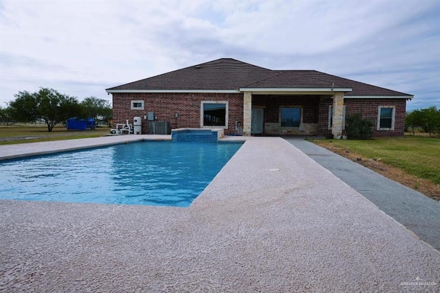 view of pool featuring an in ground hot tub and a patio area