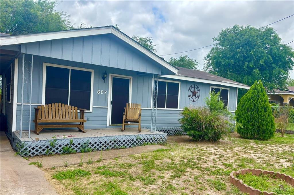 607 S Mile 1 Rd, Mission, TX 78572 - view of front facade with a porch and board and batten siding
