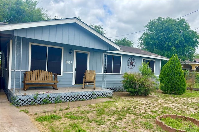 607 S Mile 1 Rd, Mission, TX 78572 - view of front facade with a porch and board and batten siding