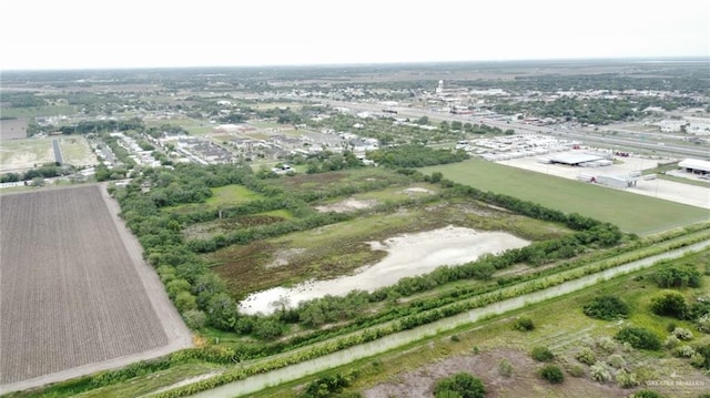 birds eye view of property with a rural view