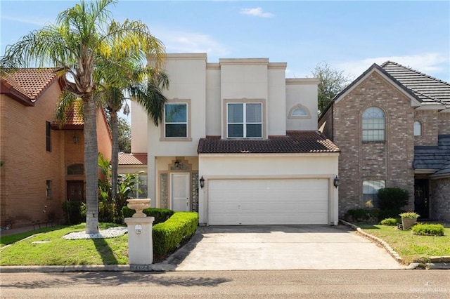 view of front of house with a tiled roof, an attached garage, driveway, and stucco siding