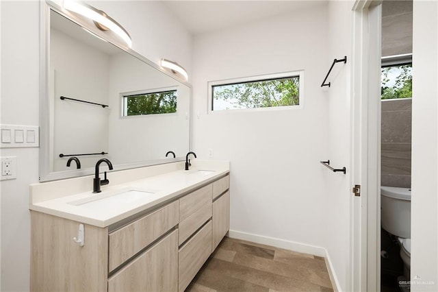 3804 S M St, Mcallen, TX 78503 - full bath with toilet, plenty of natural light, double vanity, and baseboards