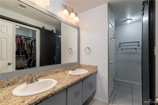 bathroom with vanity and tile patterned flooring