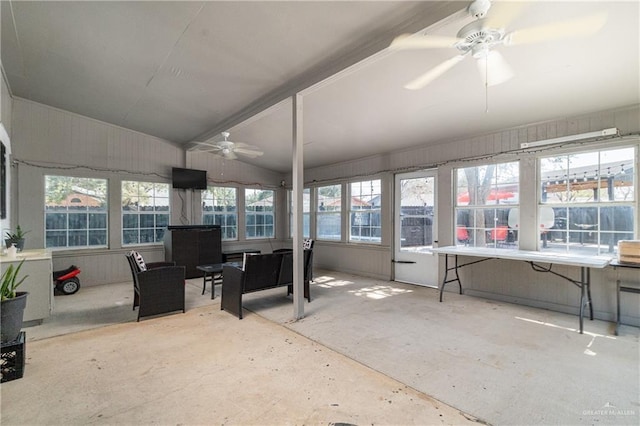 sunroom with lofted ceiling and ceiling fan