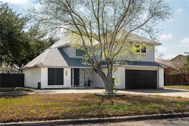 view of front of home featuring a garage and a front yard