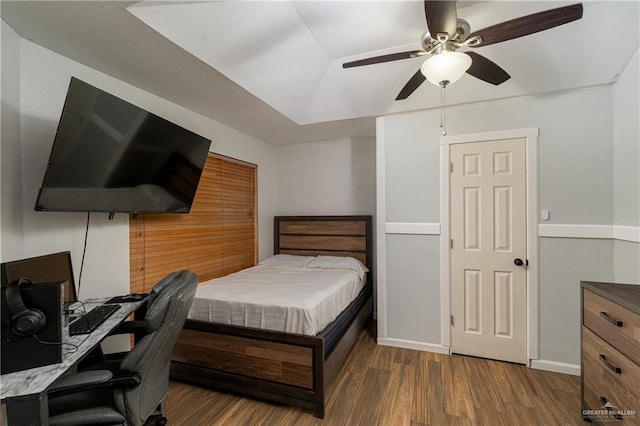 bedroom with ceiling fan and dark hardwood / wood-style floors