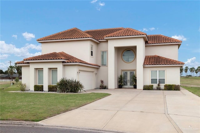 mediterranean / spanish house with a garage, stucco siding, a front lawn, and french doors