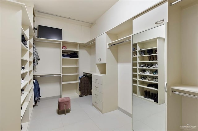 walk in closet featuring light tile patterned floors