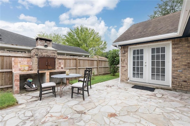 4201 N Palm Dr, Pharr, TX 78577 - view of patio featuring outdoor dining space, a fireplace, and fence
