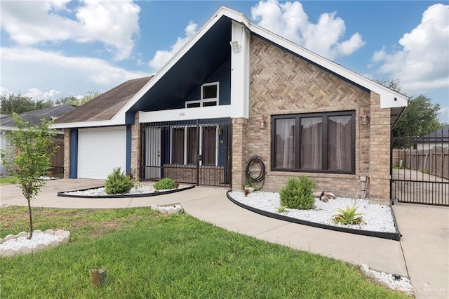 4201 N Palm Dr, Pharr, TX 78577 - view of front facade with an attached garage, concrete driveway, brick siding, and fence