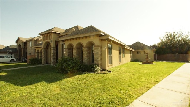 view of side of home with a lawn