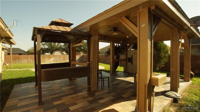 view of patio / terrace with a gazebo and ceiling fan