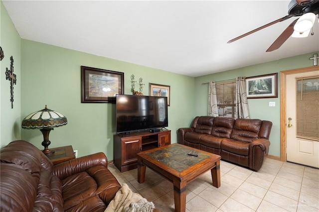 tiled living room featuring ceiling fan