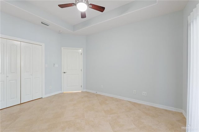 unfurnished bedroom featuring a closet and ceiling fan