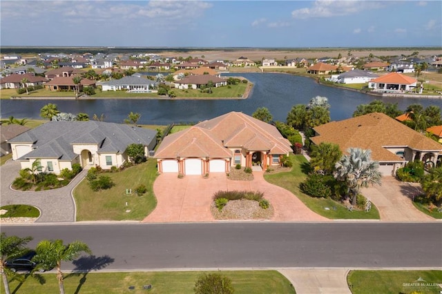 birds eye view of property featuring a water view