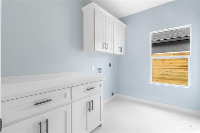 laundry area featuring cabinets, washer hookup, and electric dryer hookup