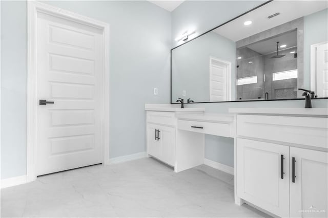 bathroom with an enclosed shower and vanity