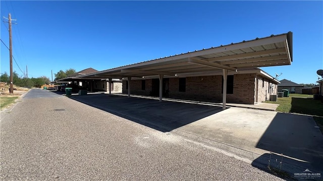 view of parking / parking lot featuring a carport