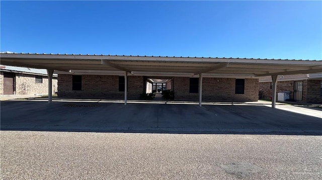 view of vehicle parking with a carport