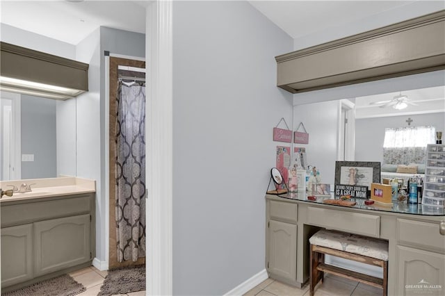 bathroom with curtained shower, tile patterned flooring, vanity, and a ceiling fan