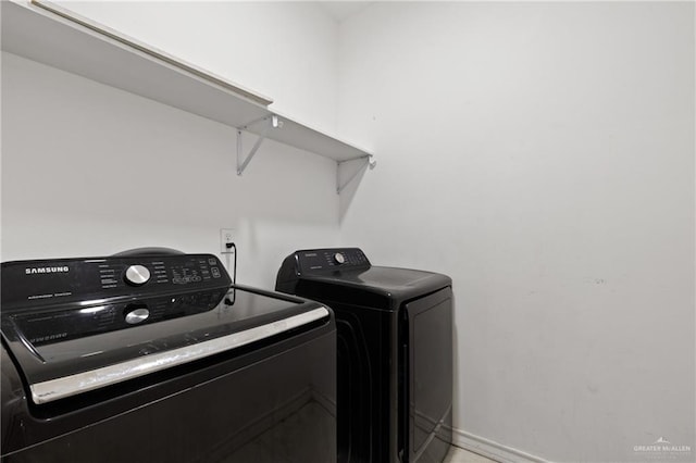 clothes washing area featuring independent washer and dryer