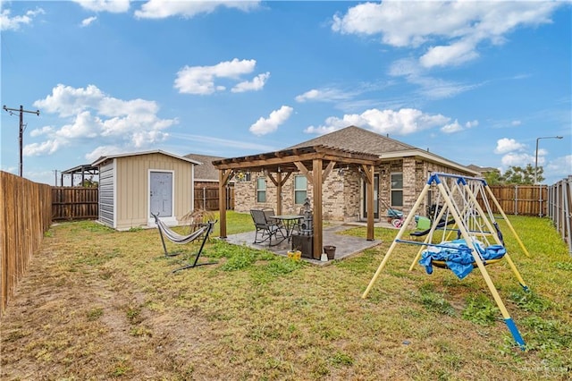 back of property featuring a playground, a patio area, a yard, and a storage unit