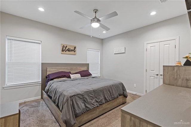 bedroom with ceiling fan and a closet